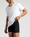 Man showcasing Black Boxer Briefs 12-Pack waistband, highlighting form-fitting design.
