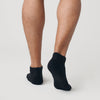 Black Ankle Socks 12-Pack on feet, showcasing seamless, contour design.