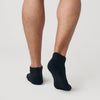 Black Ankle Socks 3-Pack on feet, showcasing seamless heel design.