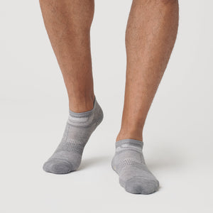 True ClassicHeather Gray Ankle Socks 12-Pack on feet, showcasing seamless toe design.