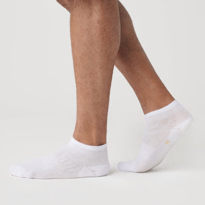 True ClassicWhite Ankle Socks 12-Pack on feet against a white background.
