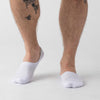 White Never Show Socks 12-Pack on feet, tattoo visible.
