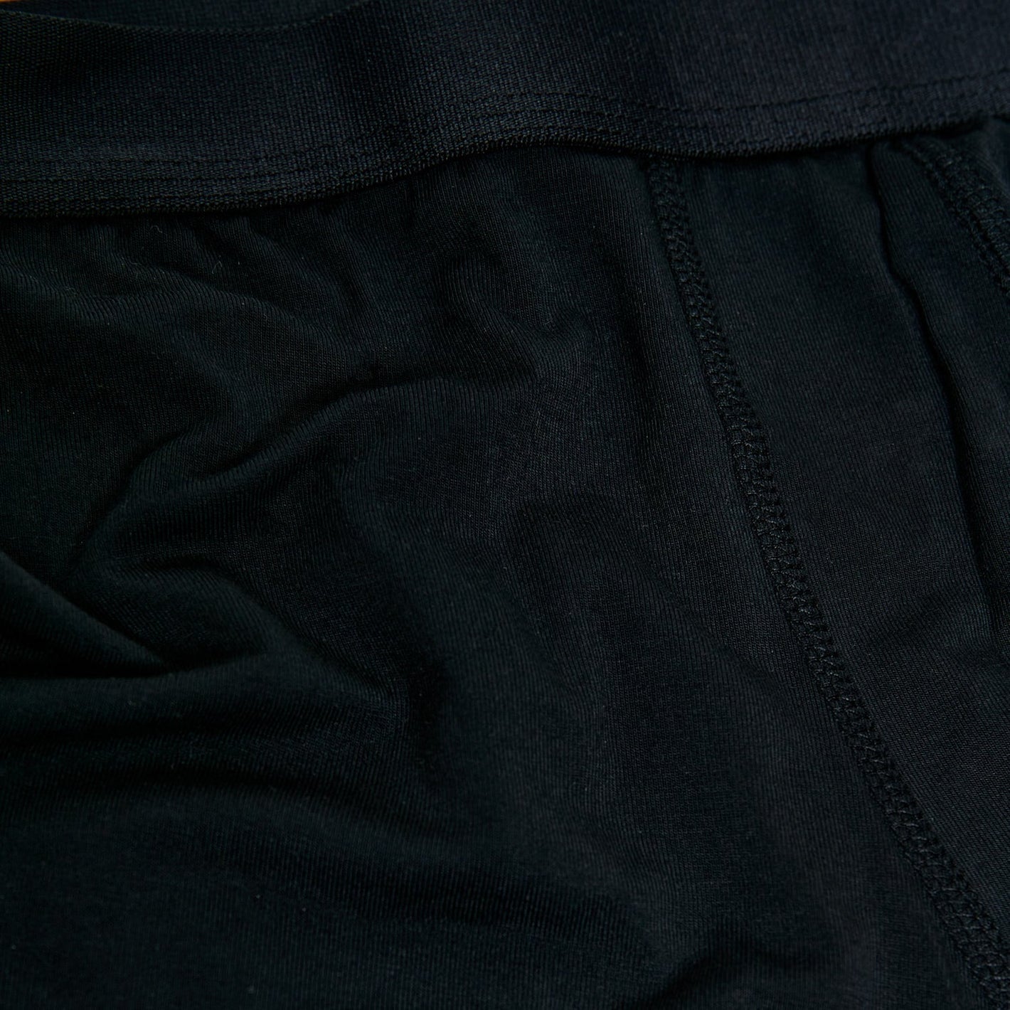 Black Boxer Trunks 6-Pack with stretchy waistband and visible stitching.