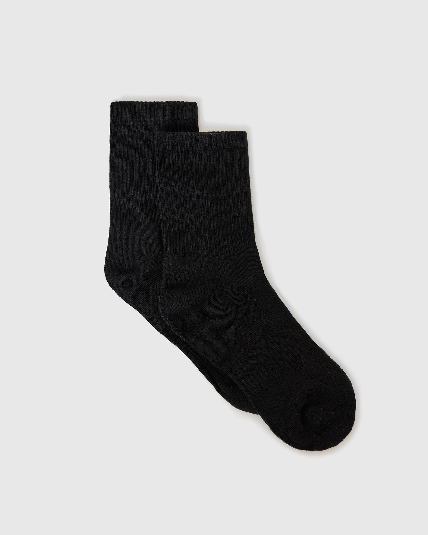 Black Half Crew Socks 6-Pack laid flat, showcasing seamless toe and contour seam.