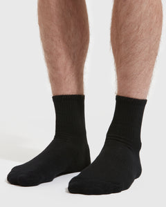 True ClassicBlack Half Crew Socks 6-Pack on feet, showcasing seamless toe seam.