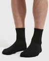 Black Half Crew Socks 12-Pack on legs, showcasing seamless toe and contour seam.
