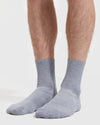 Heather Gray Half Crew Socks 3-Pack on legs, showcasing ribbed texture.