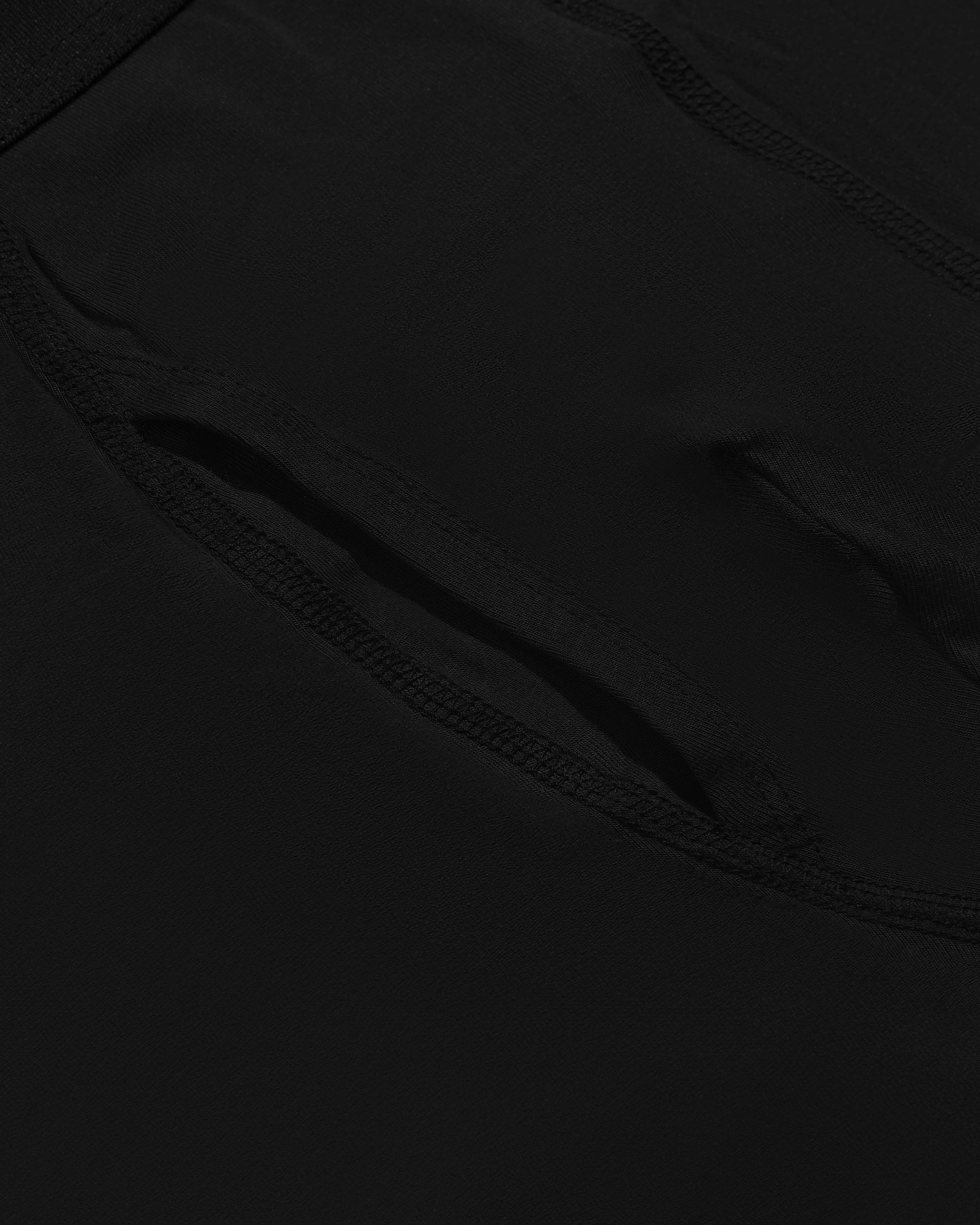 Black Boxer Briefs W/ Fly 12-Pack, close-up of textured fabric and seam.