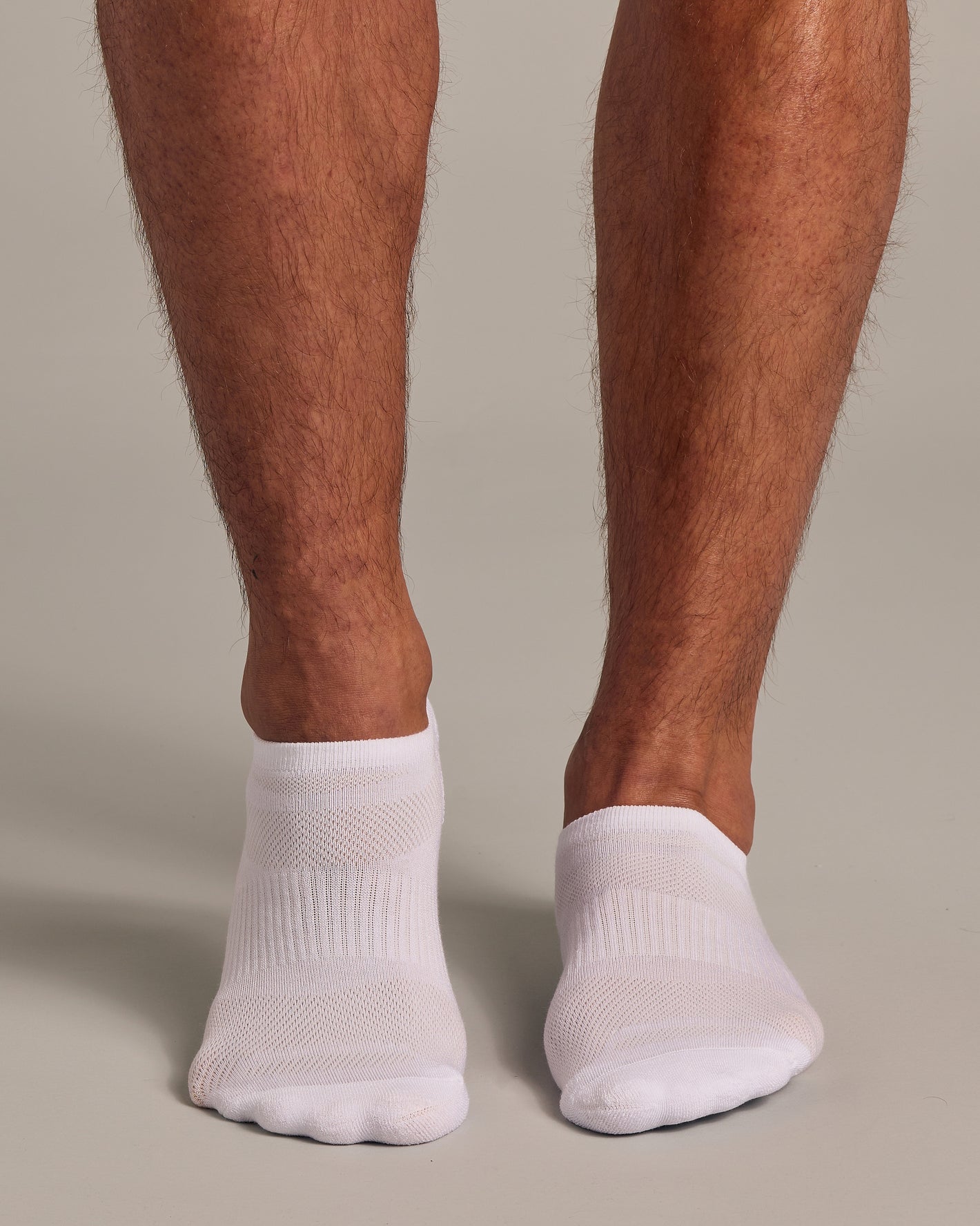 White No Show Socks 3 Pack 2 0 on feet, seamless and snug.