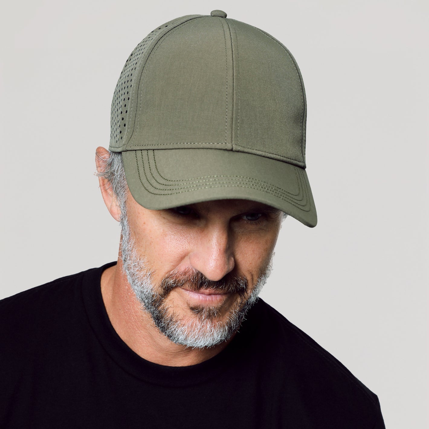 Man wearing Military Green All Purpose Cap.