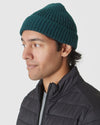 Evergreen Sweater Beanie on young man, side profile shot.