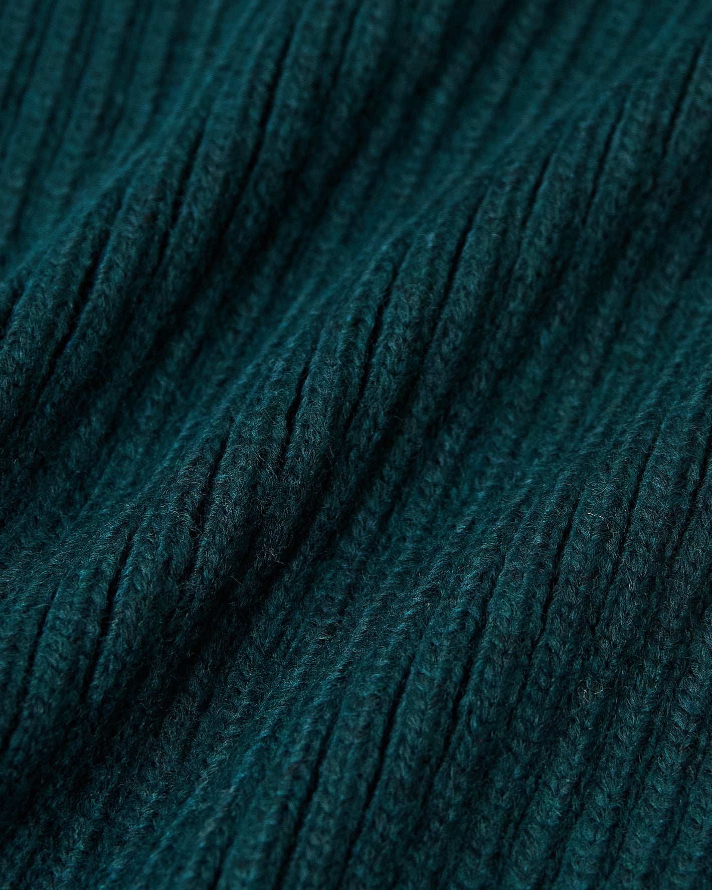 Evergreen Sweater Beanie with ribbed, fuzzy knit texture, dark teal.