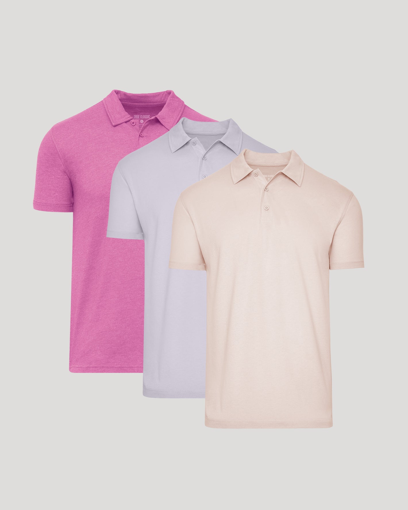 Limited Short Sleeve Classic Polo 3-Pack, overlapping in pink, lilac, peach.
