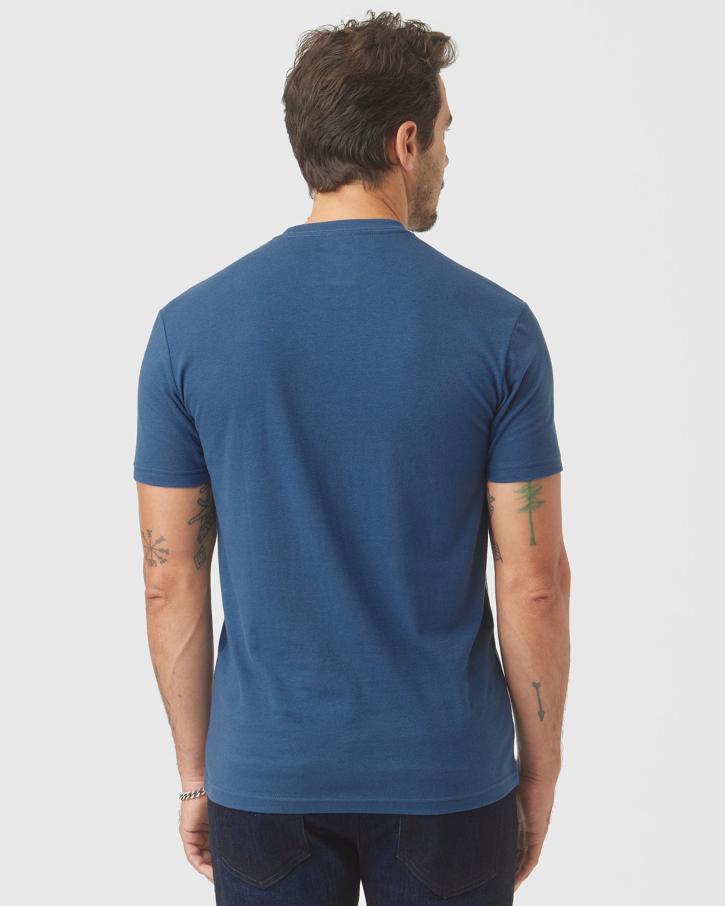 Man wearing Deep Sea Blue Classic Crew Neck T-shirt.