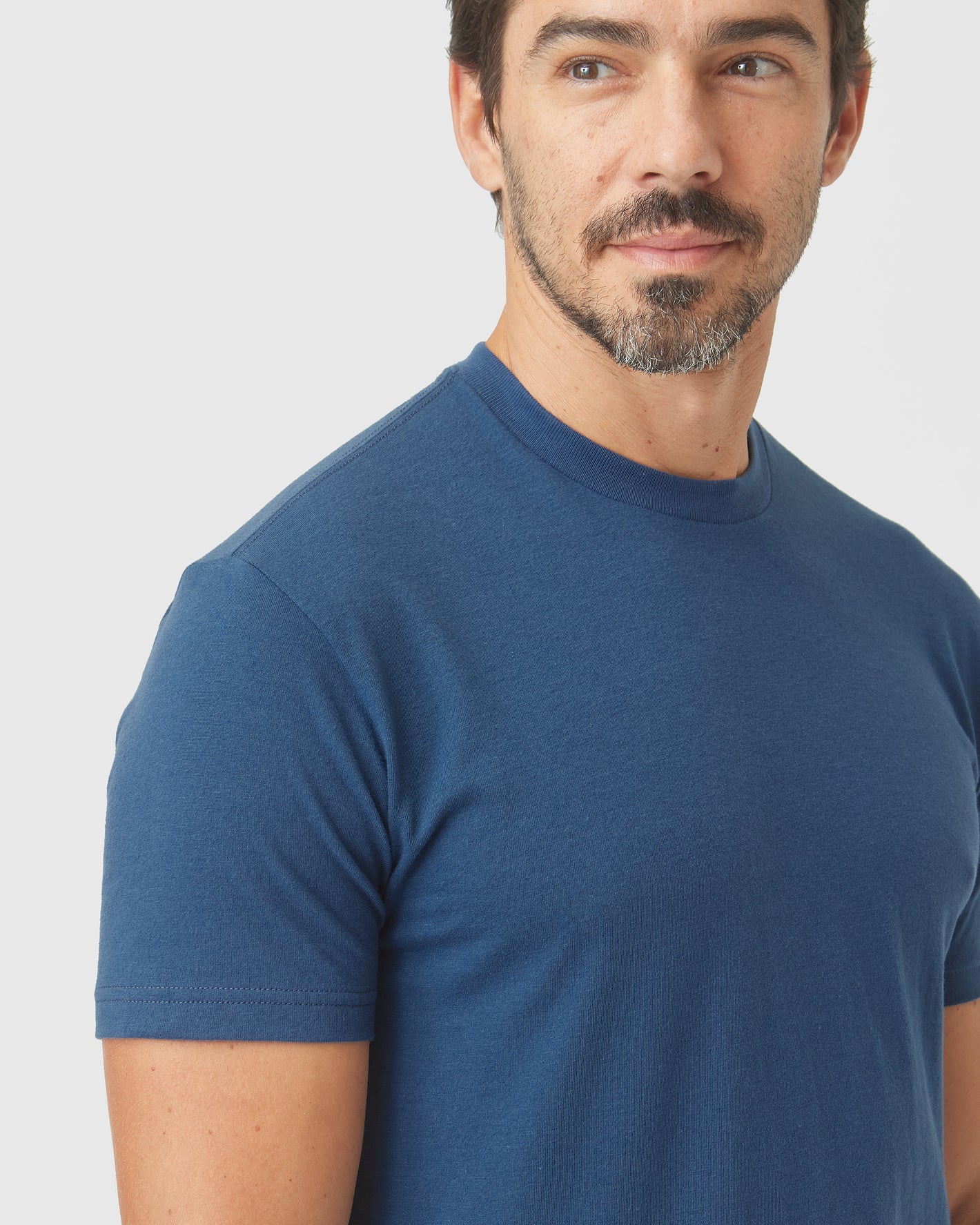 Man wearing Deep Sea Blue Classic Crew Neck T-shirt.