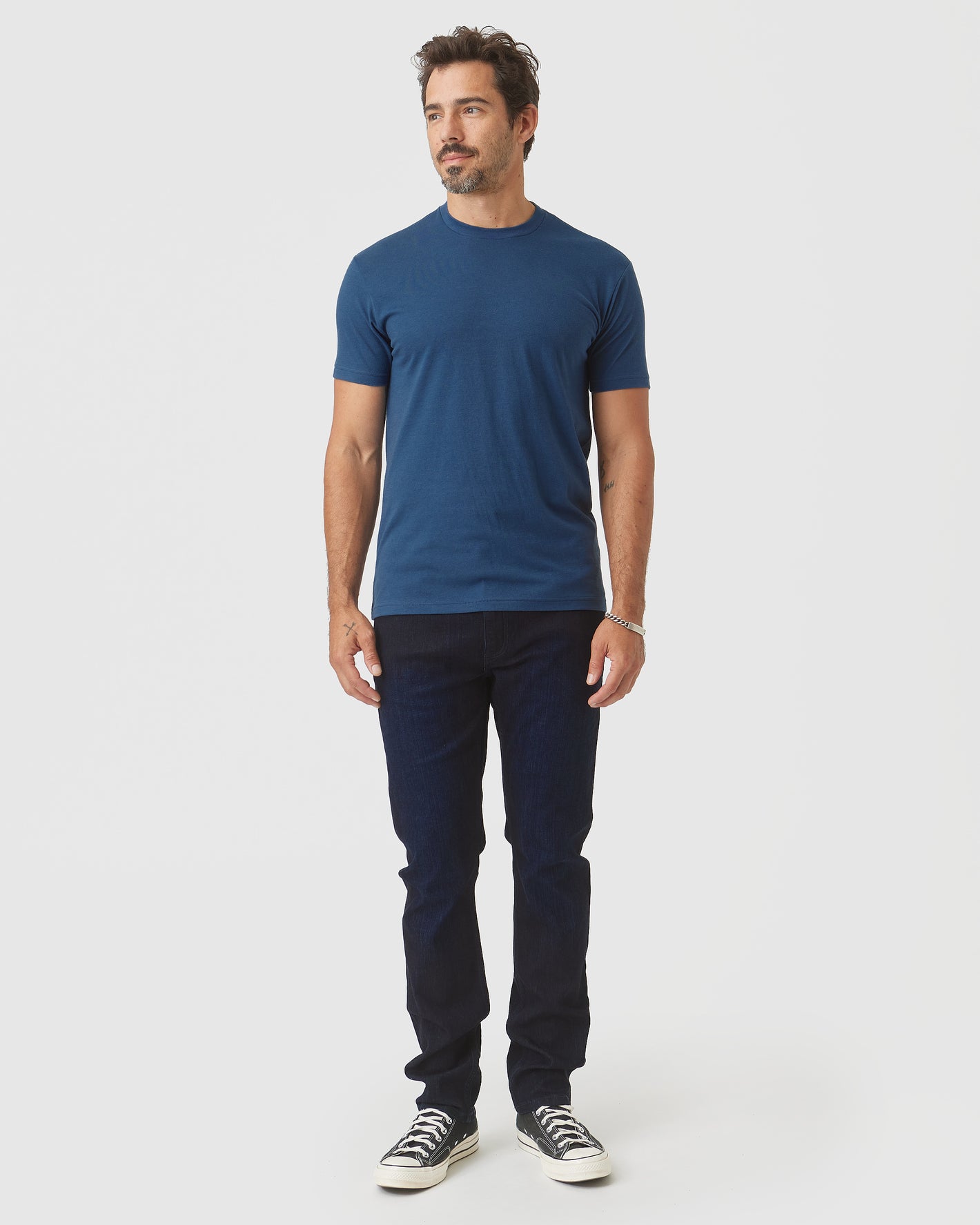 Deep Sea Blue Classic Crew Neck on man in jeans and sneakers.