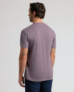 True ClassicMan in Dark Heather Amethyst Classic Crew Neck, showing tattoos.