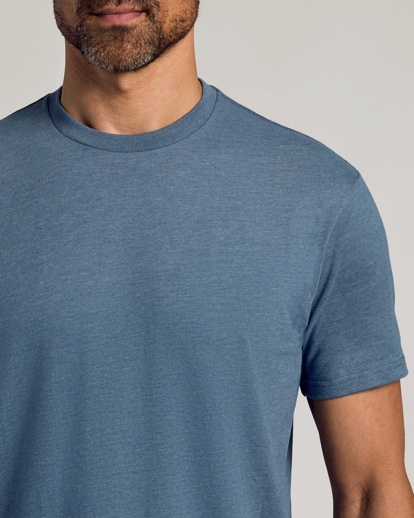Dark Heather Tempest Classic Crew Neck on man, showing upper torso and jawline.