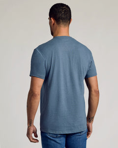True ClassicBack view of man in Dark Heather Tempest Classic Crew Neck t-shirt.