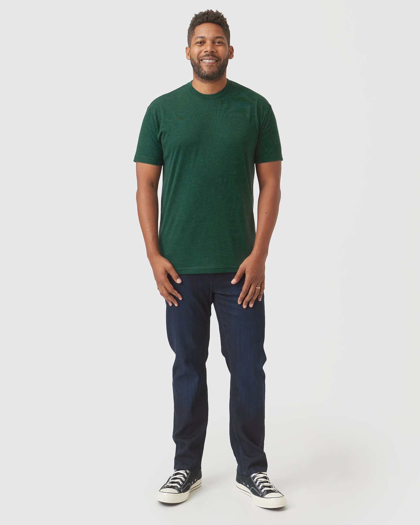 Evergreen Heather Classic Crew Neck on model with jeans and sneakers.