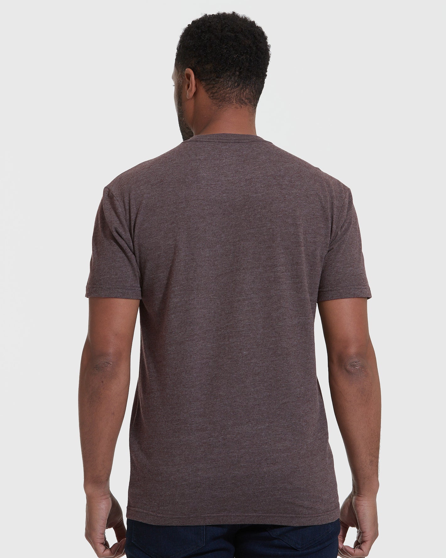 Man in Heather Dark Oak Crew Neck T Shirt, back view.