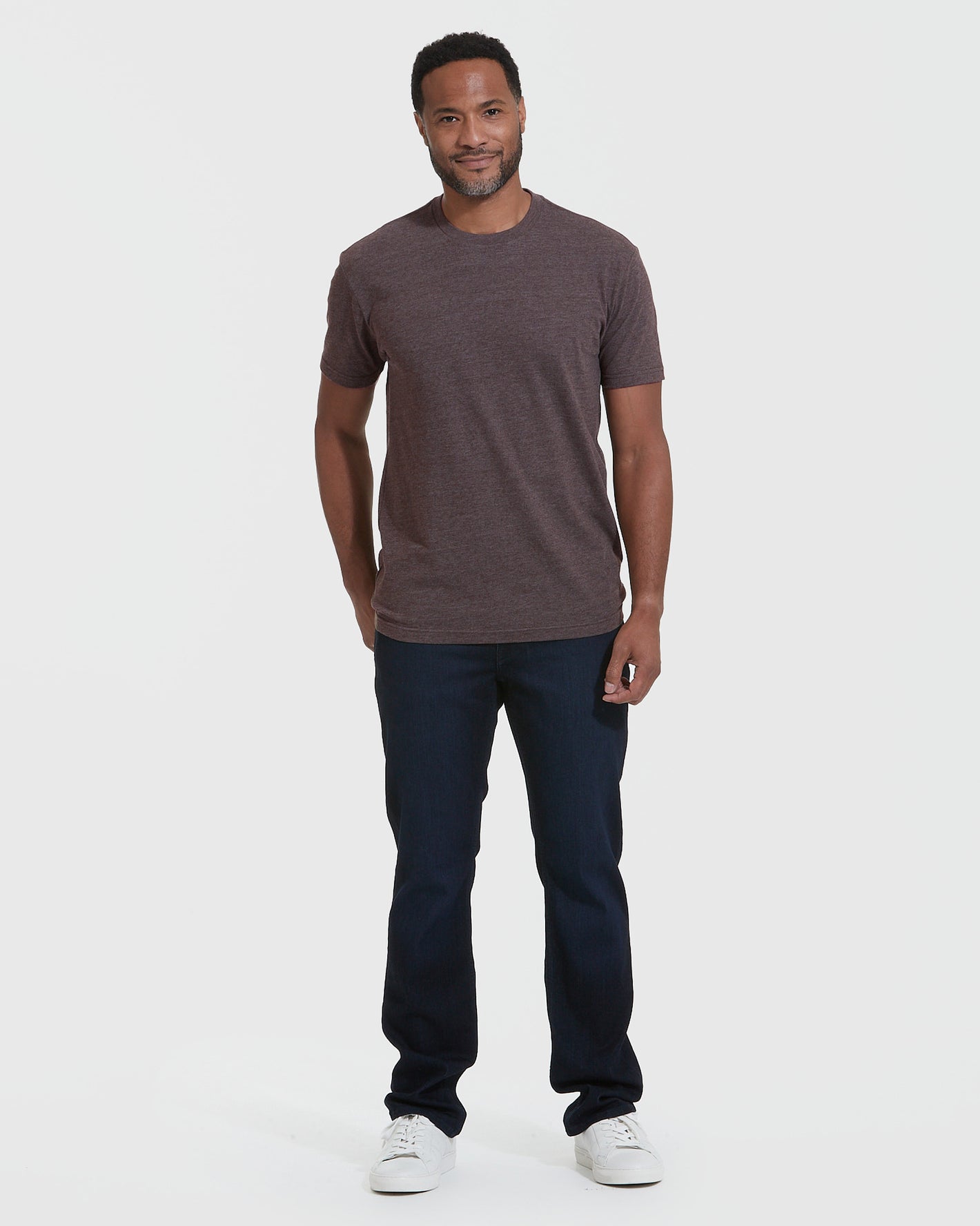 Heather Dark Oak Crew Neck T-Shirt on man with jeans and sneakers.