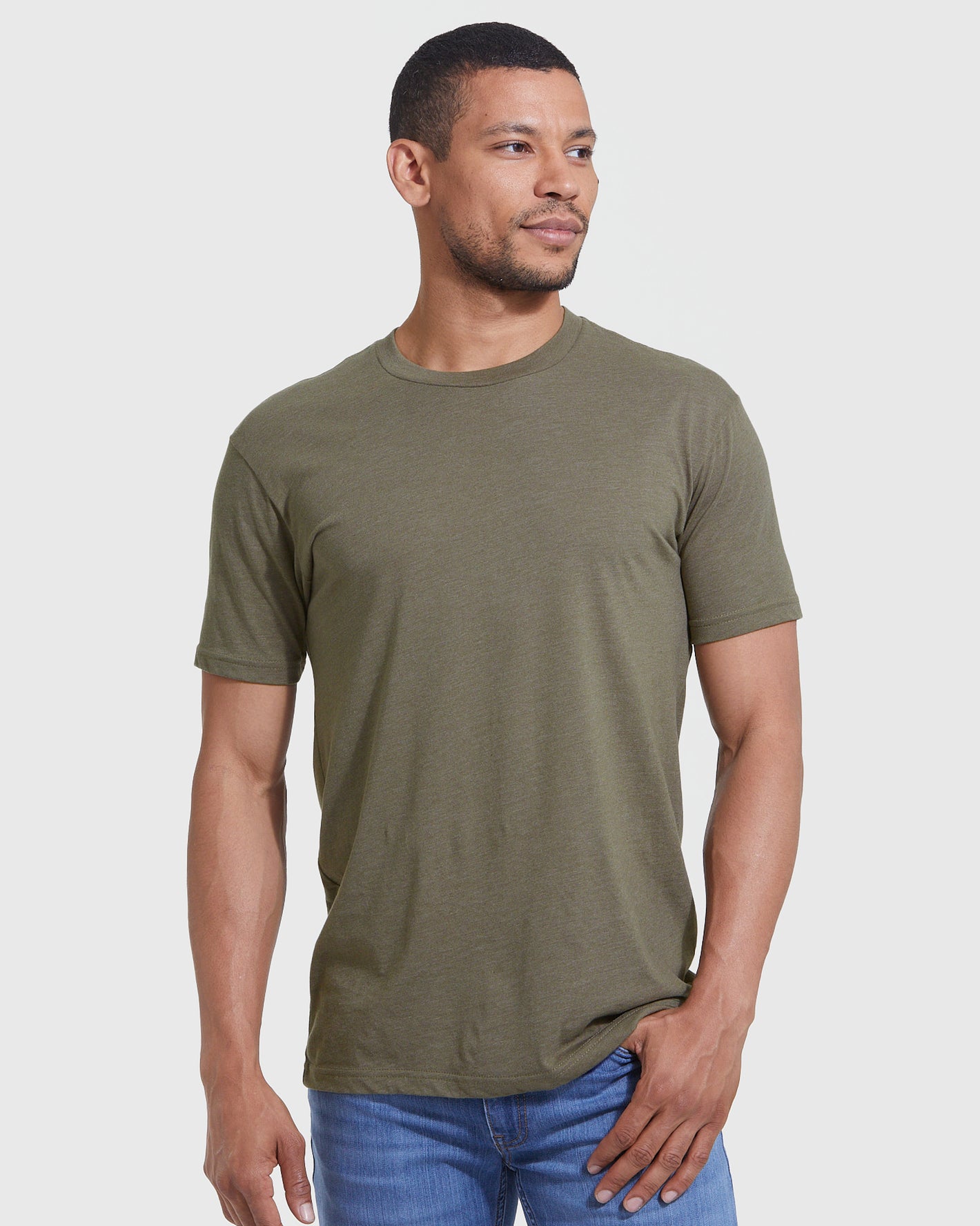 Man wearing Heather Military Green Classic Crew Neck and blue jeans.