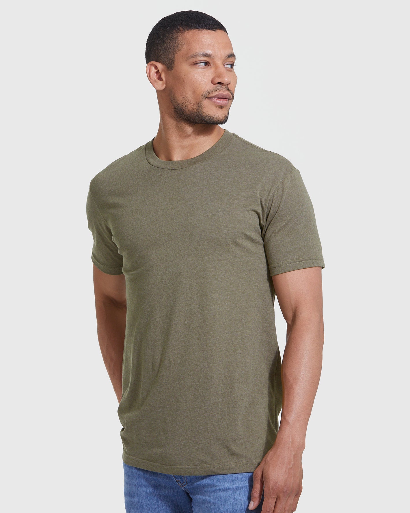 Man wearing Heather Military Green Classic Crew Neck T-shirt with jeans.