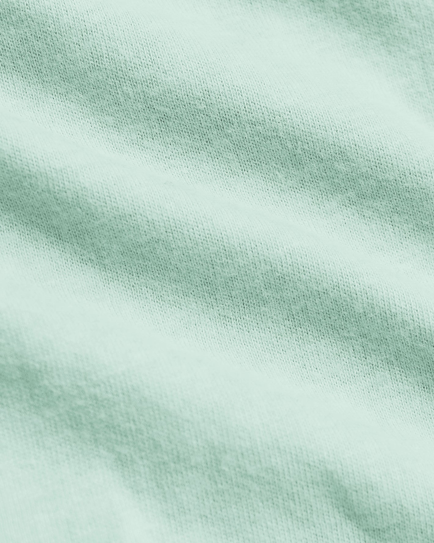 Heather Mist Classic Crew Neck with soft mint-green knit fabric detail.