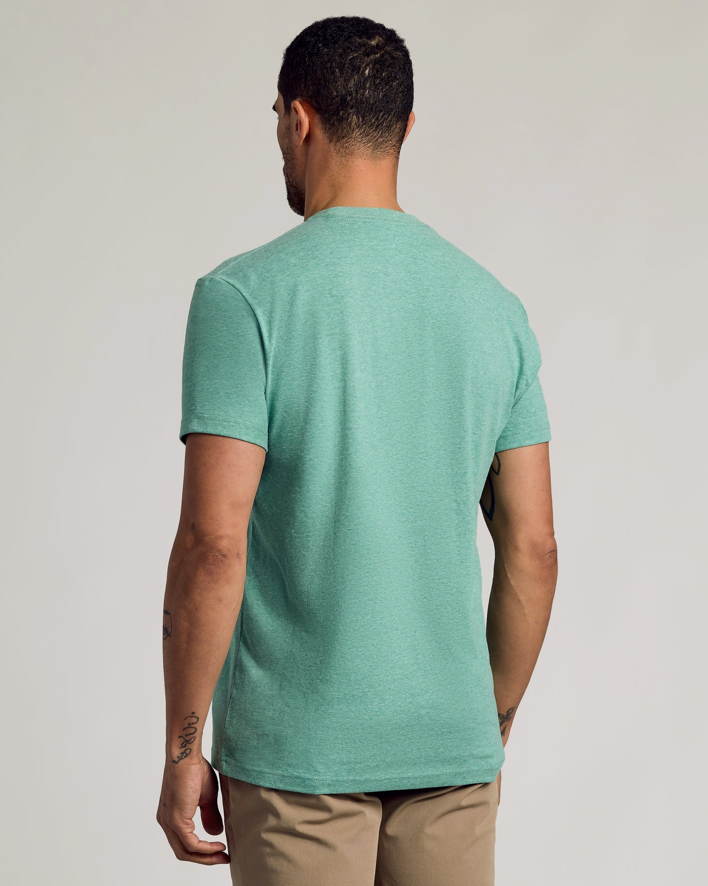 Back view of Light Heather Greenery Classic Crew Neck on male model.