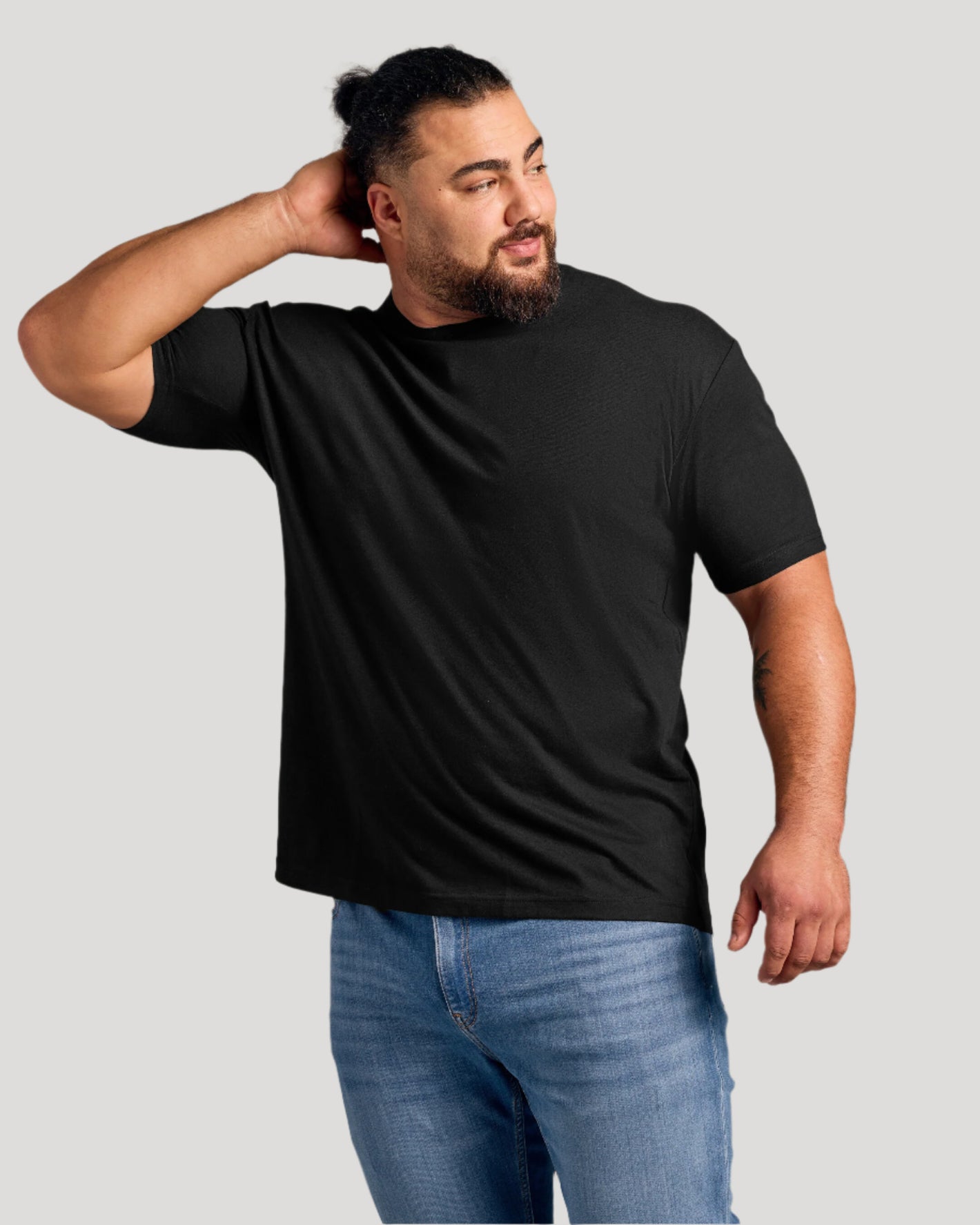 Man in black Crew Core Sleeve Variety 6-Pack T-shirt, casual pose.