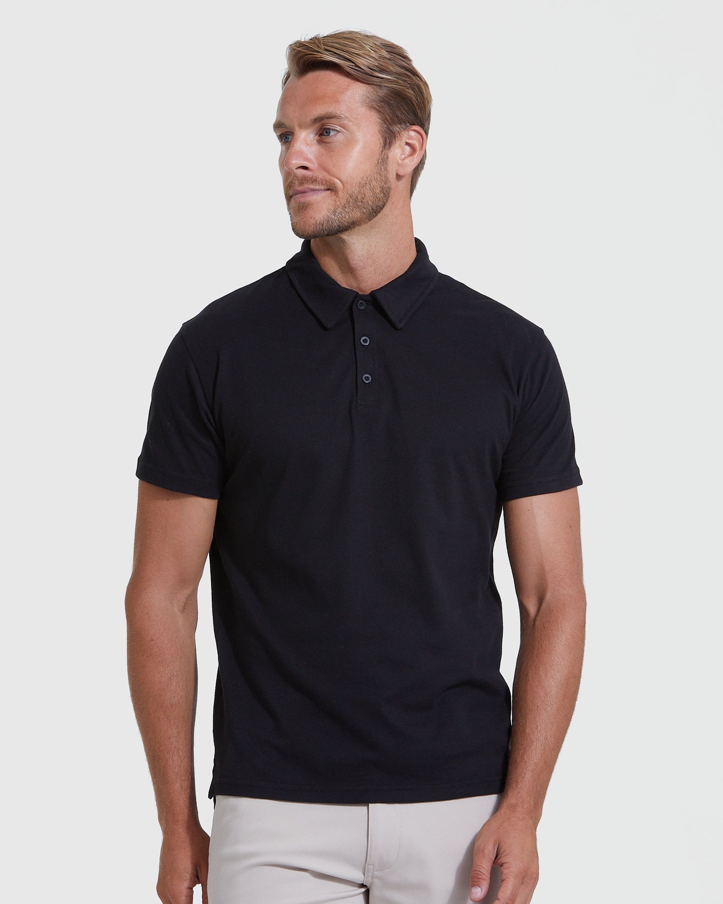 Black Classic Polo 3-Pack modeled, showcasing the fitted, short-sleeve design.