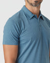 Man wearing Blue Lake Heather Classic Polo, light-blue, short-sleeve, three-button.