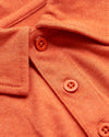Burnt Orange Heather Classic Polo, close-up of collar and buttons.