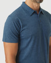 Deep Sea Blue Heather Classic Polo on male torso, short sleeves, fold-over collar.
