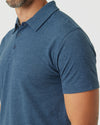 Man wearing Deep Sea Blue Heather Classic Polo, showcasing collar and sleeves.