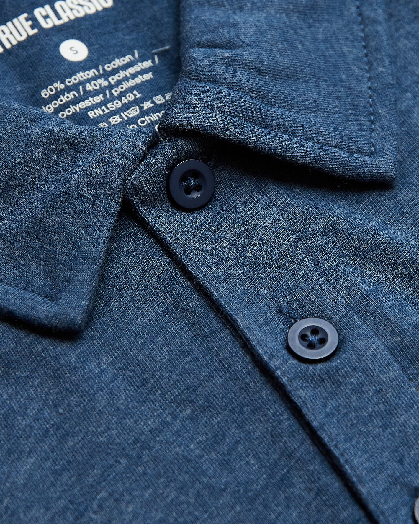 Deep Sea Blue Heather Classic Polo, spread collar, two dark blue buttons.