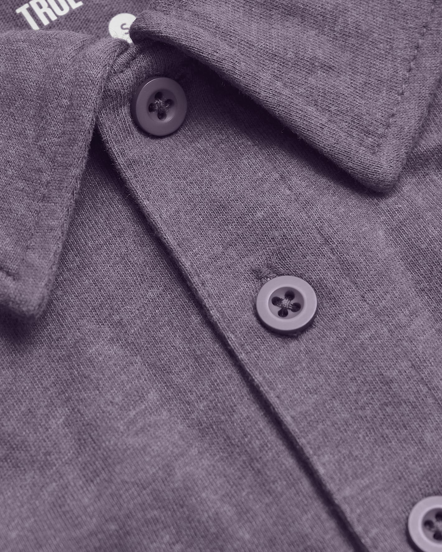 Dark Heather Amethyst Short Sleeve Polo close-up showing collar and buttons.