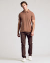 Man wearing Dark Heather Sepia Classic Polo with dark slim-fit pants.