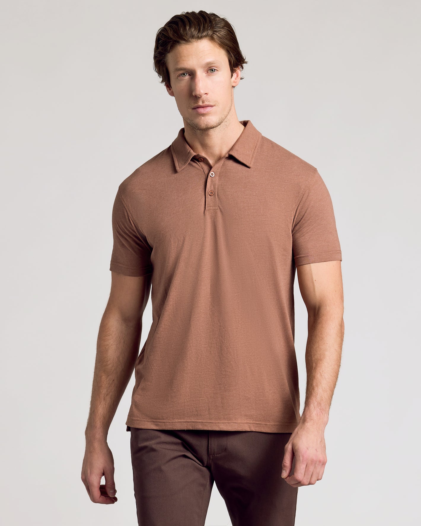 Young man wearing Dark Heather Sepia Classic Polo.