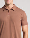 Man wearing Dark Heather Sepia Classic Polo, showcasing its fit and design.