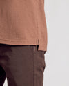 Dark Heather Sepia Classic Polo hem over dark trousers.