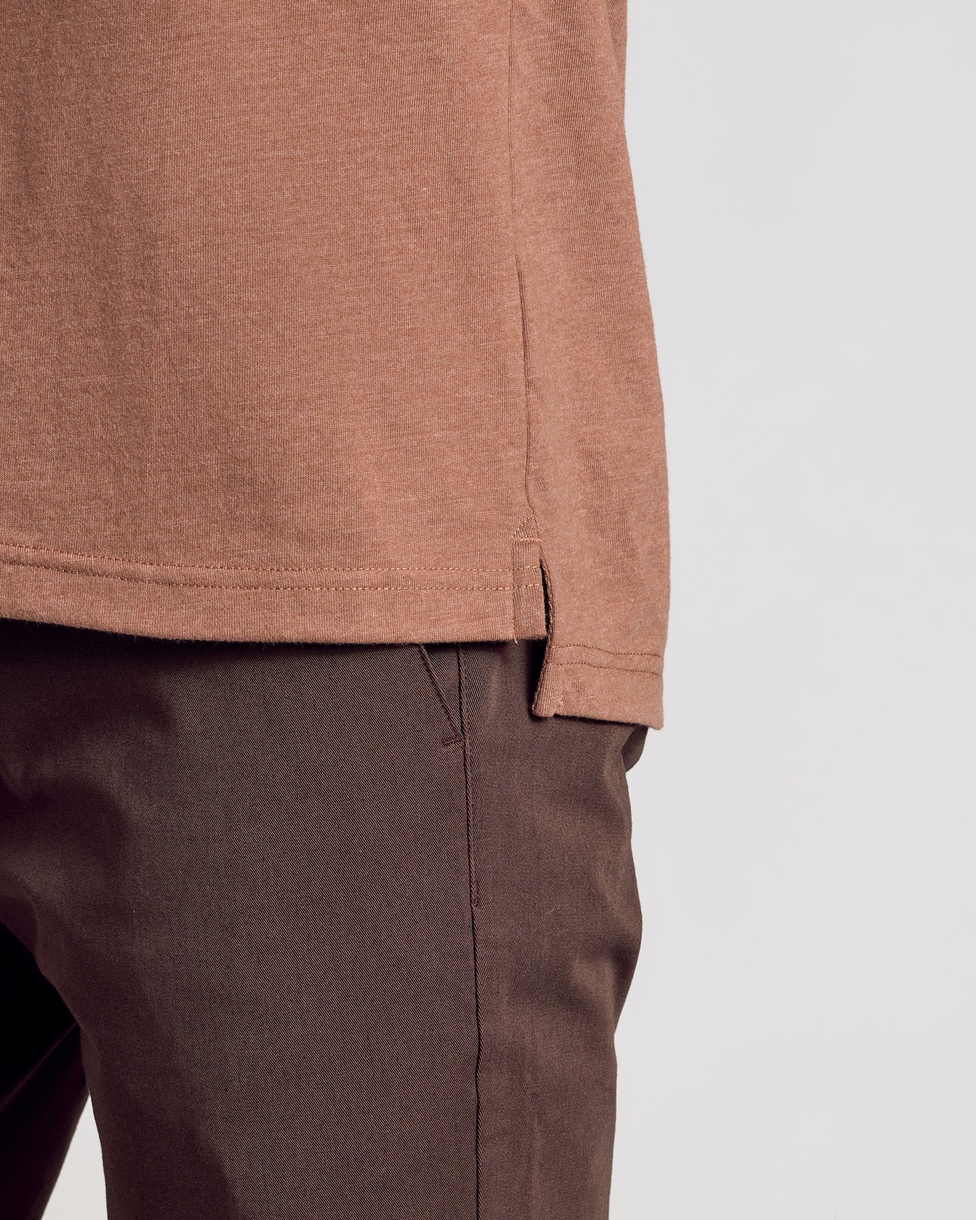 Dark Heather Sepia Classic Polo hem over dark trousers.