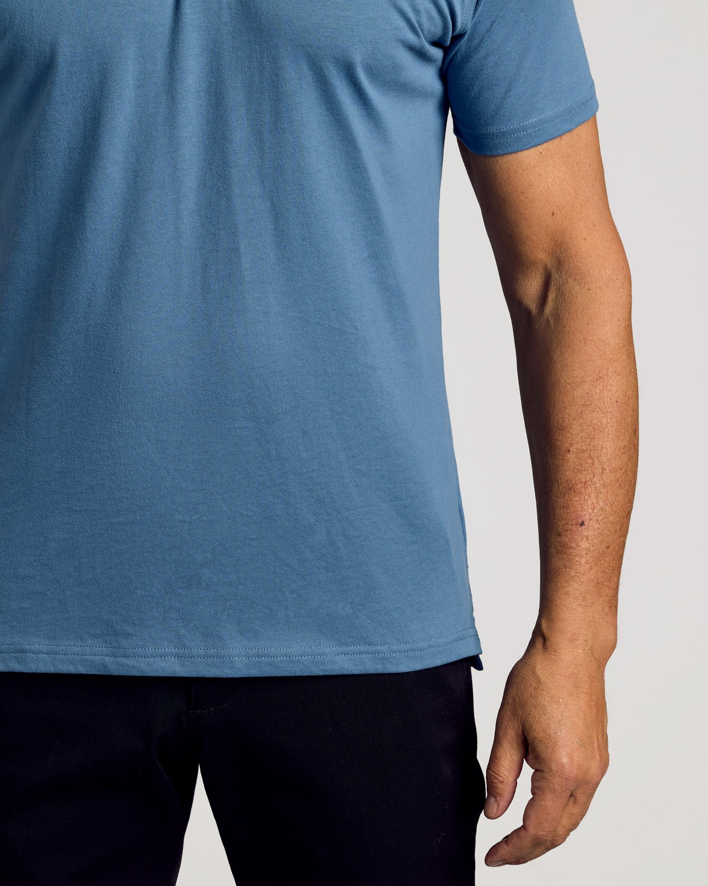 Fiord Classic Polo worn by a person, showcasing its fit and style.