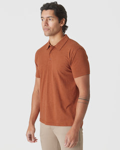 True ClassicMan models Heather Gingersnap Mane Classic Polo with beige trousers.