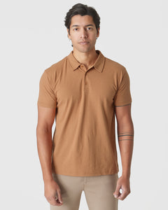 True ClassicGolden Mane Classic Polo worn by a young man, standing forward.