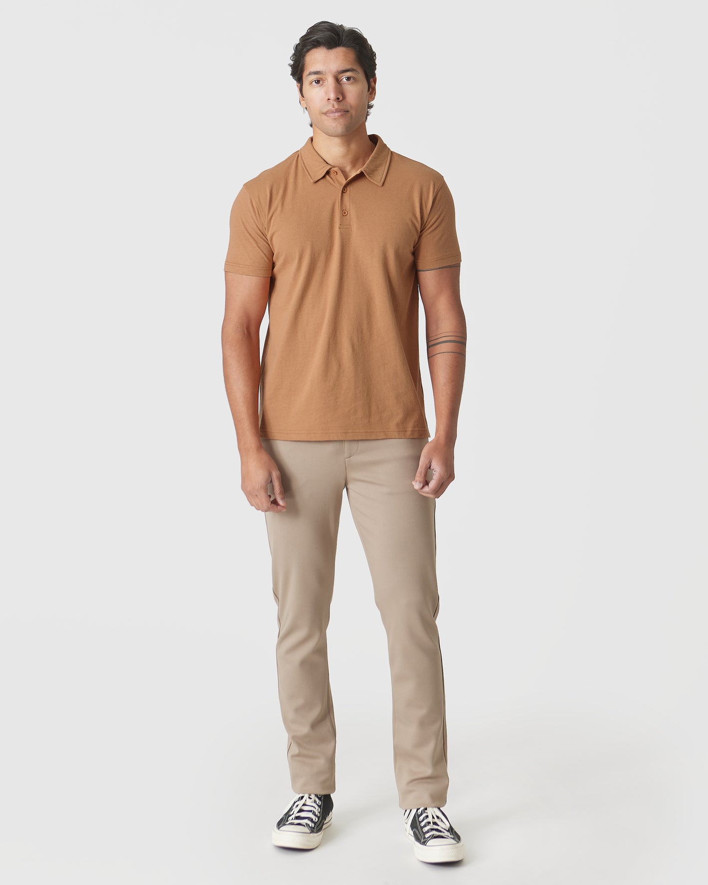 Man wearing Golden Mane Classic Polo with chinos and sneakers.