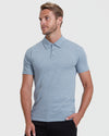 Man wearing The Light Indigo Short Sleeve Polo 3-Pack, casual pose.