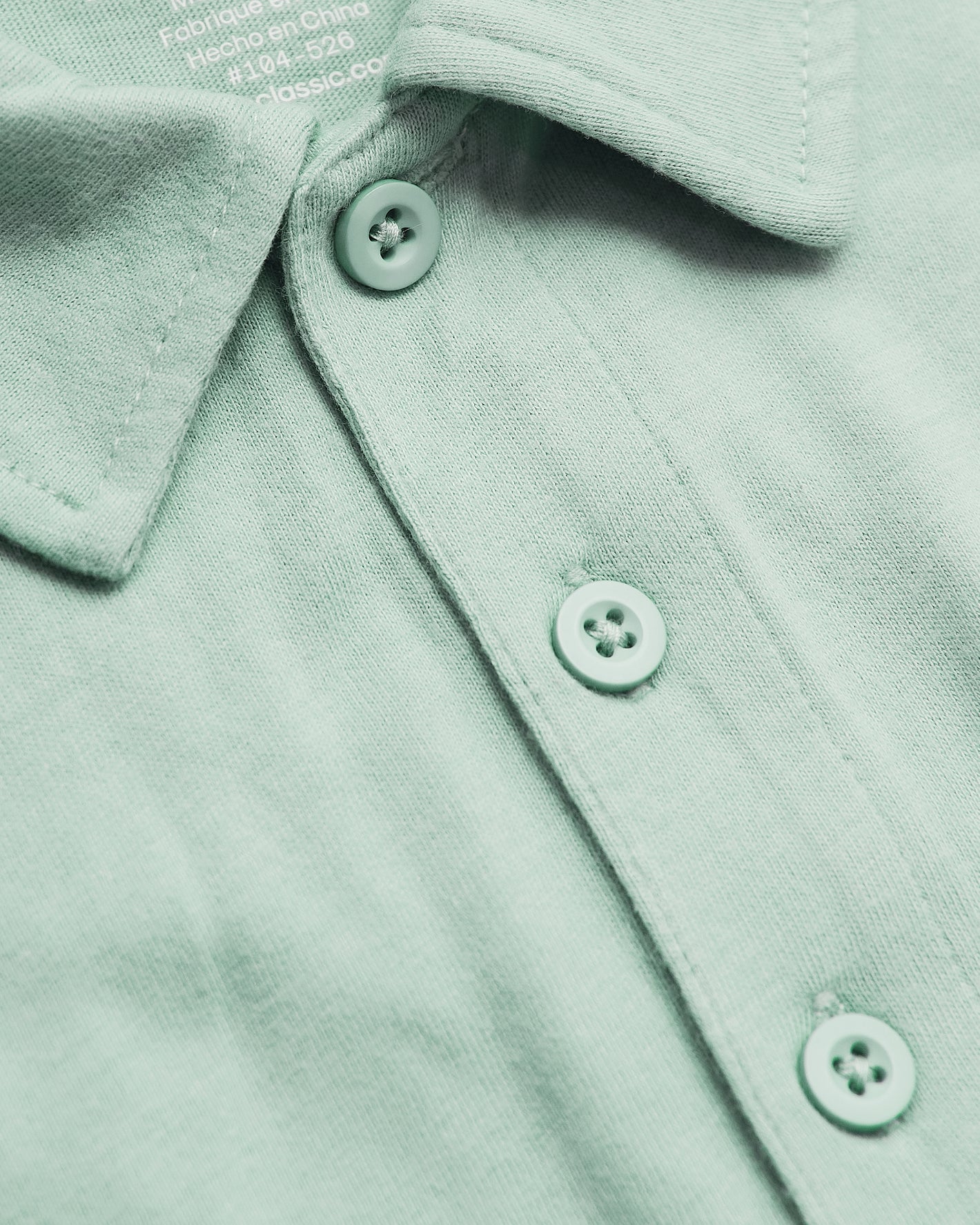 Heather Mist Short Sleeve Polo with collar and three-button placket close-up.