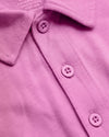 Heather Magenta Classic Polo with knit texture and three-button placket.